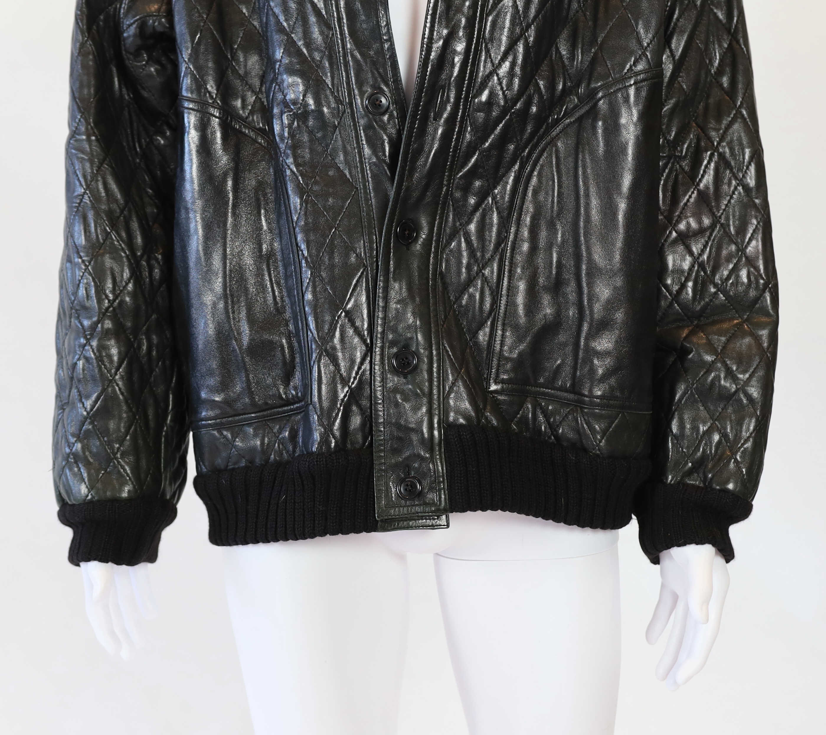 A Yves Saint Laurent Fourrures gentlemen's black quilted leather bomber jacket with fur collar and lining, approx size 42